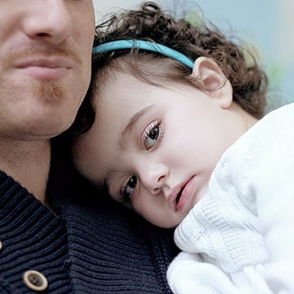 Photo of father and daughter - SickKids' grants management system was timeconsuming