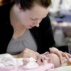Photo of mother and infant - with SmartSimple there's fewer mistatkes in processing data