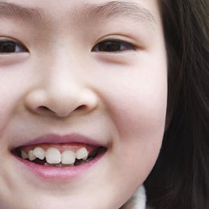 Young girl smiling and looking into camera