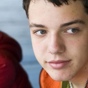 Close up of a young boy looking to one side