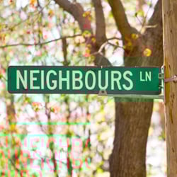 A green street sign displaying a street name: 