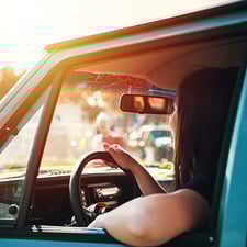 Lady driver sitting in a car driving
