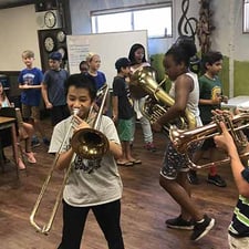 Children musicians rehearsing together