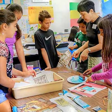 Children working together in a class room setting