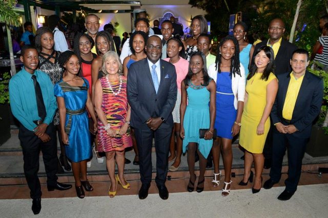 Minister of Education, Youth and Information, Senator Ruel Reid (centre), shares a photo opportunity with 2016 awardees of the National Commercial Bank (NCB) Foundation’s scholarships and grants, at a ceremony held recently at The Courtleigh Hotel & Suites in New Kingston .