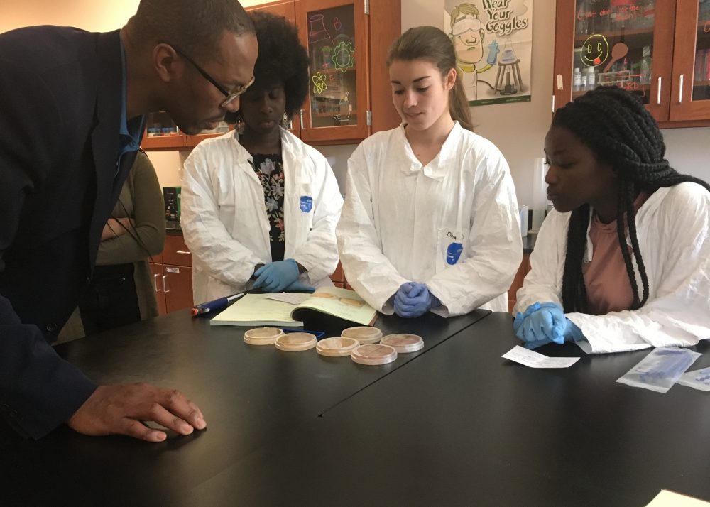 Massachusetts Life Sciences President and CEO Travis McCready visits with Worcester students participating in the MLSC 