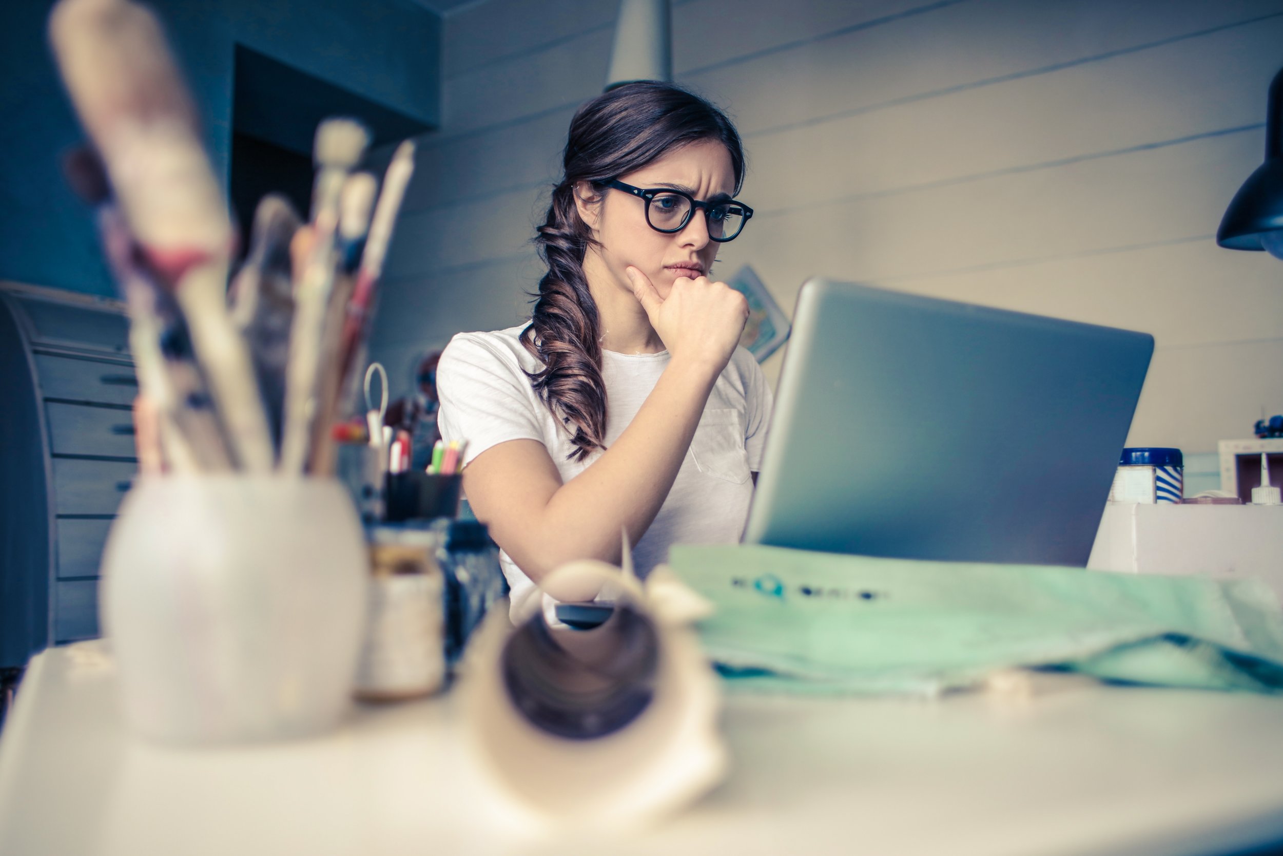 Woman looking working at computer. Photo by Bruce Mars