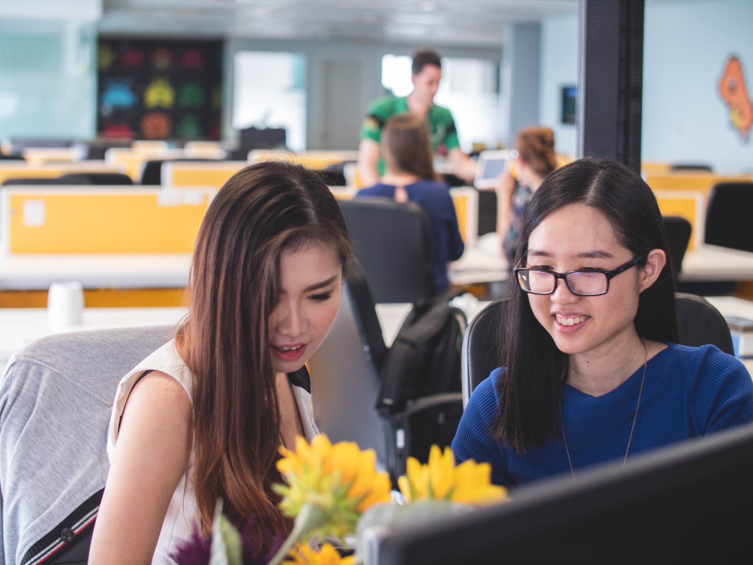  Women working in an office. Photo by Mimi Thian 