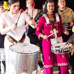 Women drummers performing